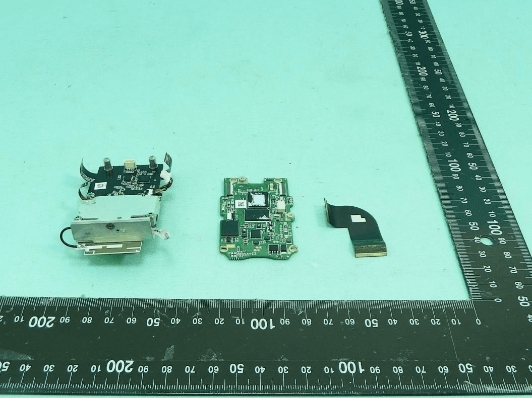 Main PCB with SoC, camera module, and flexible interconnects.