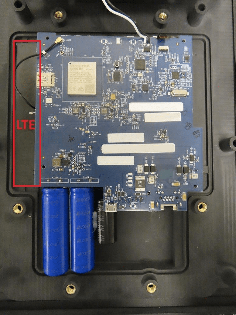 Main PCB with LTE module, large battery pack, and dedicated RF antenna.