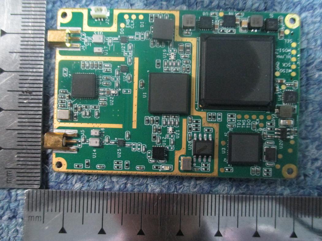 High-density PCB with processor, connectors, and test points for debugging.