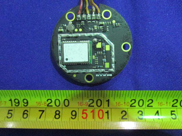 RF module PCB with metal shielding and crystal oscillator.