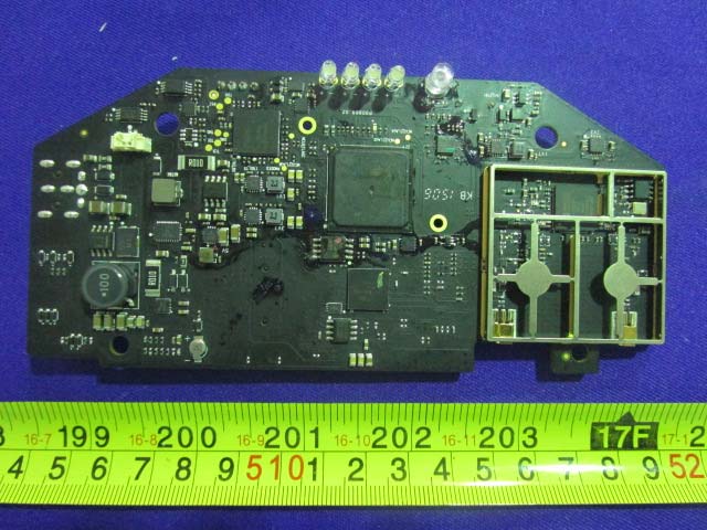 Dense PCB layout with RF shielding and power management components.