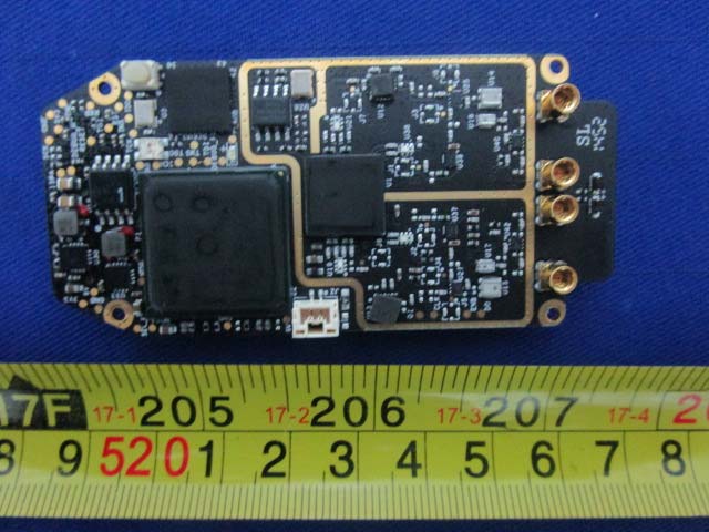 PCB with shielded processor and multiple RF antenna connectors.