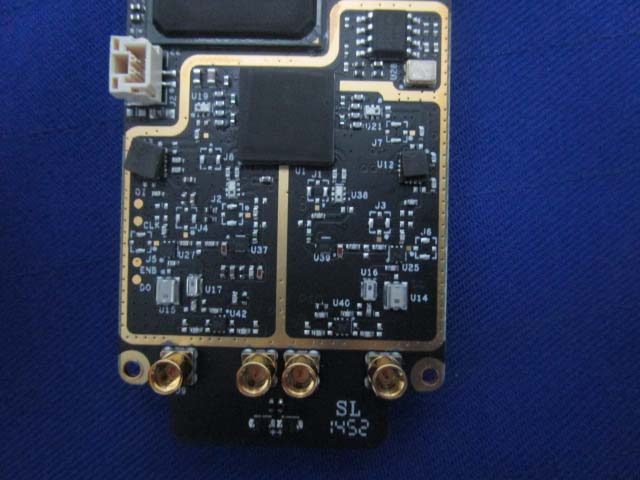 Compact PCB housing RF transceivers and antenna connectors.