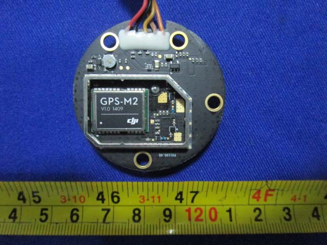 DJI GPS module with integrated shielding for precise positioning.
