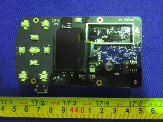 PCB with ribbon cable connector and metal shield for RF components.