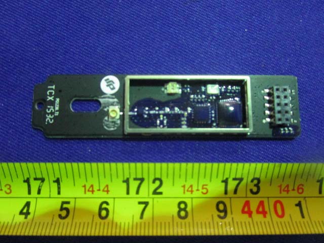Main PCB featuring ICs, shielding, and compact connector layout.