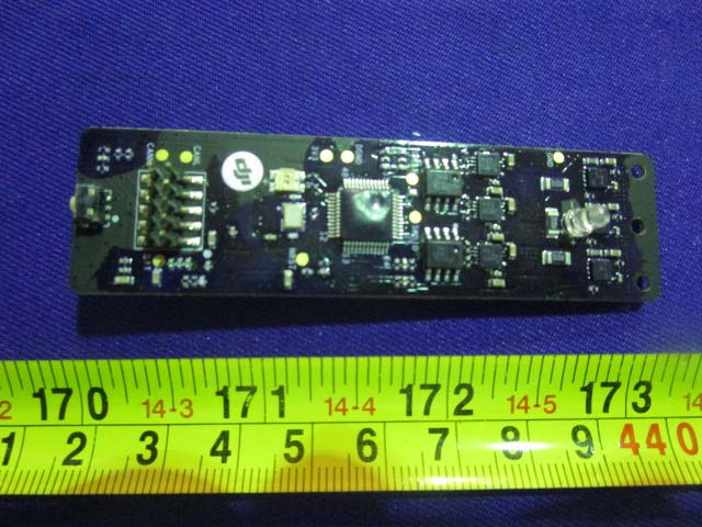 PCB with central microcontroller, support ICs, and integrated status LEDs.