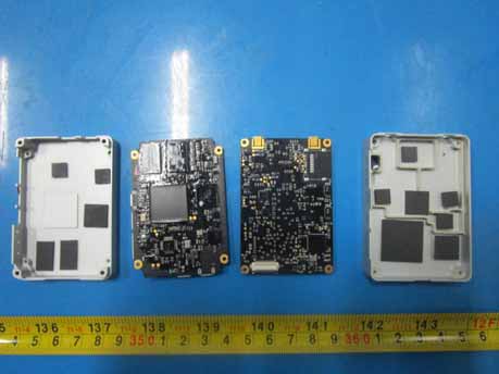 Main PCBs with flight controller, memory, and RF shielding.