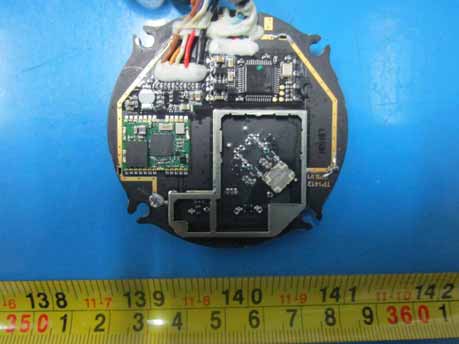 Circular PCB module with SoC and shielded RF section.