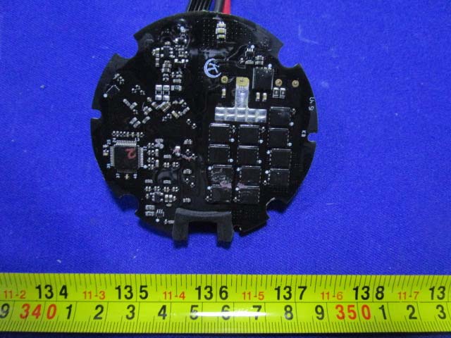 Circular PCB with MOSFET array, likely for motor control or power distribution.