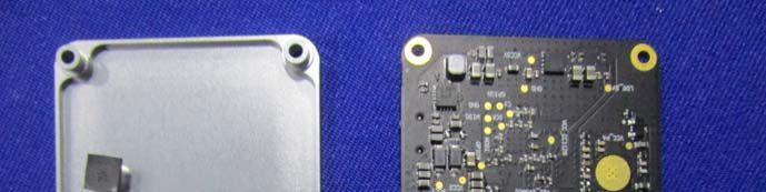 RF section exposed: ICs, decoupling, and EMI shield can.