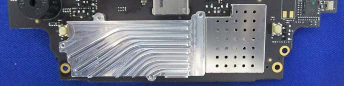 Densely packed main RF PCB with custom EMI shielding.