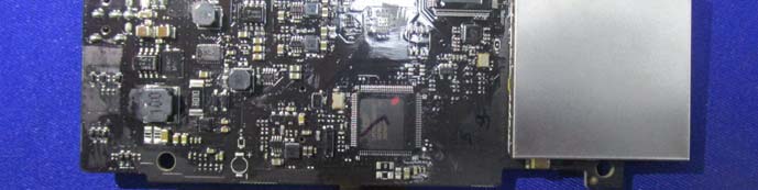 Main processor, RF shielding, and power regulation on densely populated multi-layer PCB.