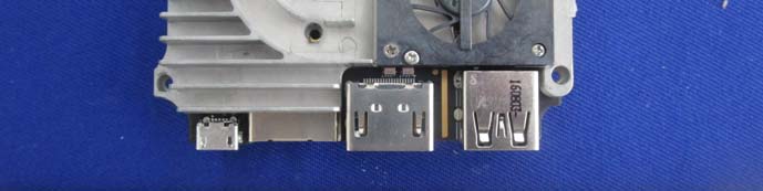 I/O board with HDMI, USB ports, and active cooling assembly.
