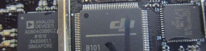 Main PCB close-up: DJI SoC, Analog Devices chip, and dense SMT layout.