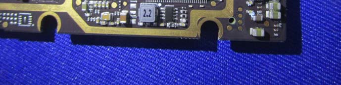 Power regulation section with 2.2 µH inductor and gold-plated edge contacts.