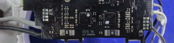 Motor driver PCB with dual custom ICs and high-current traces.