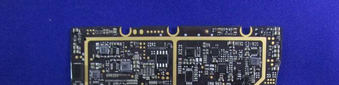 Flight controller board with microcontrollers and gold edge connectors.