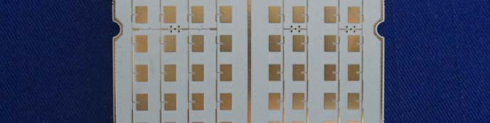 Antenna array PCB with gold-plated microstrip patches for microwave operation.