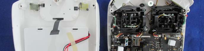 Main PCB with dual joysticks, battery, and RF cabling.