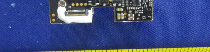 Partial PCB view with FPC connector and dense SMD component layout.