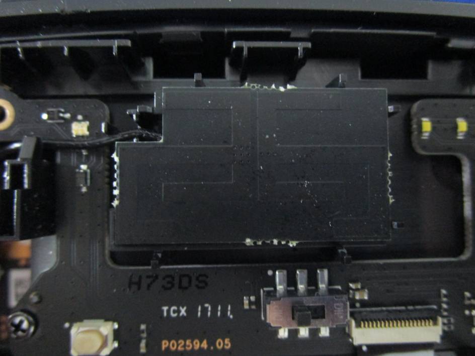 Main PCB with RF shield can and antenna coaxial cable.