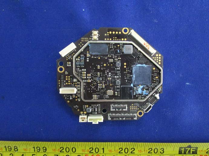 Main PCB assembly with shielding, dual ICs, and modular connectors.