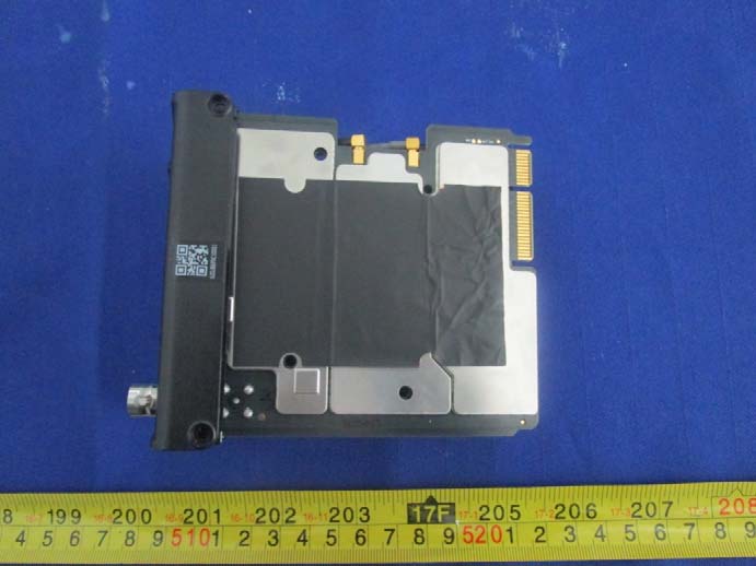 Shielded RF/digital module with coaxial and edge connectors.
