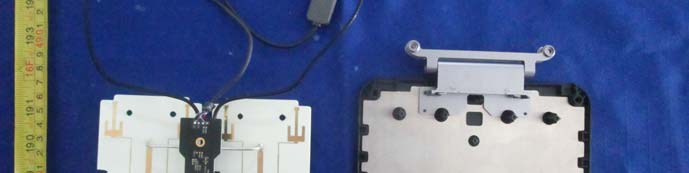 PCB-integrated antennas with adjacent EMI/RFI shield plate.