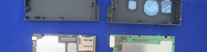 Dual PCB assemblies with EMI shields and microSD slot highlight modular RF design.