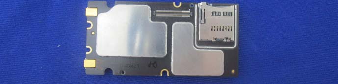 MicroSD slot and FPC connector on shielded, high-density RF/video processing PCB.