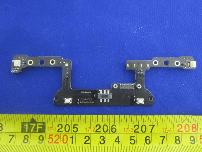 User interface sub-board with tactile switches and FPC connector.