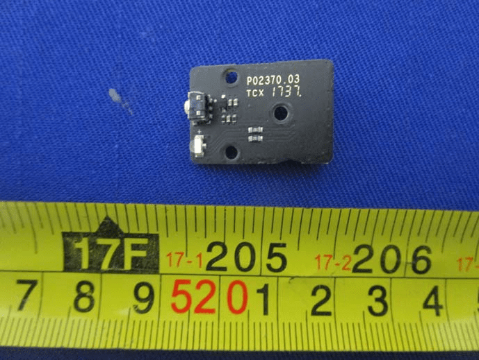 Compact sensor/interface PCB with single IC and passive components.