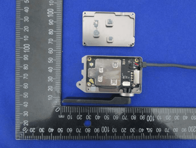 Main PCB with EMI shield, coaxial antenna, and RF/power management ICs.