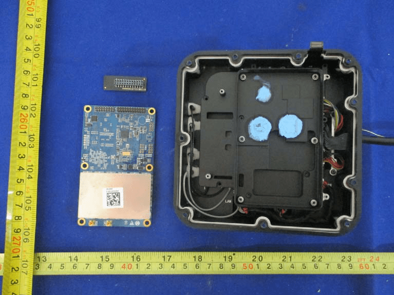 Main PCB with RF shield, power management, and antenna cabling.