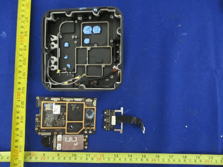 Main PCB with daughterboard, antenna connectors, and EMI shielding.