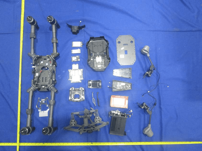 Full teardown layout: main PCBs, antennas, and power assemblies exposed.