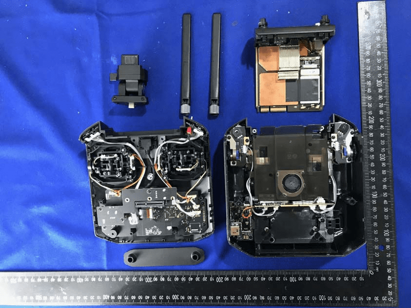 Main controller PCB with dual antennas, EMI shields, and power regulation features.