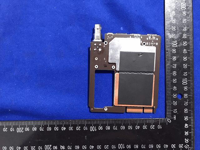 RF communication module with heavy shielding and external antenna connector.
