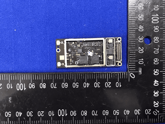 High-density logic board with shielded ICs and robust power filtering.