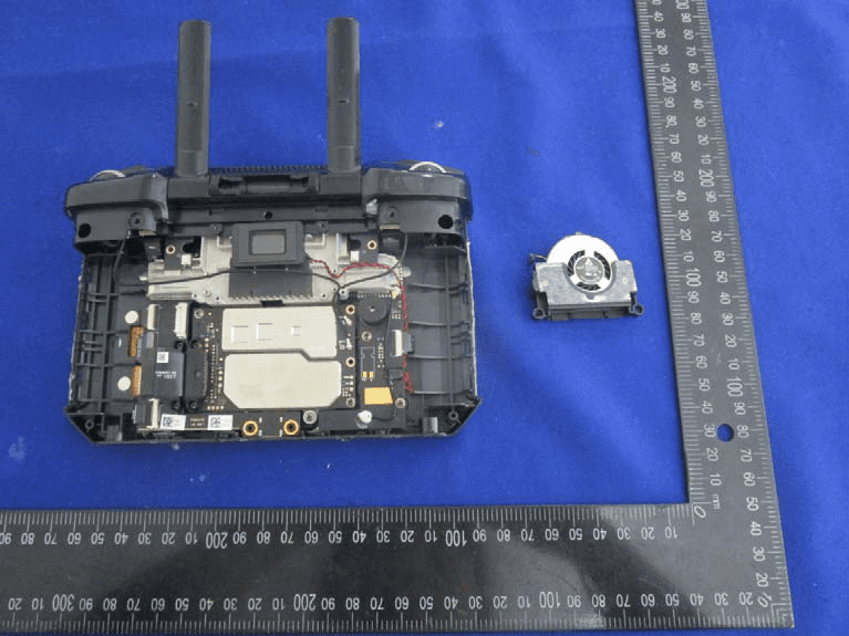 Main PCB with shielding, joystick module, and audio components.