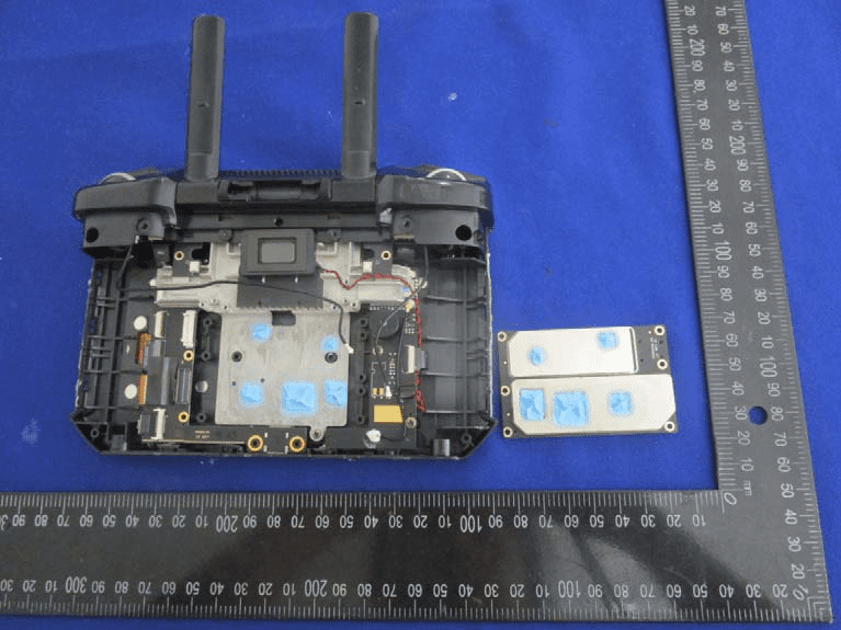 Central PCB area with thermal pads, shielding cans, and antenna connections.
