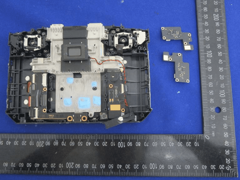 Main PCB with modular antenna boards and central shield.