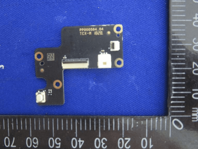 Compact interface PCB with FPC connector and tactile switch.