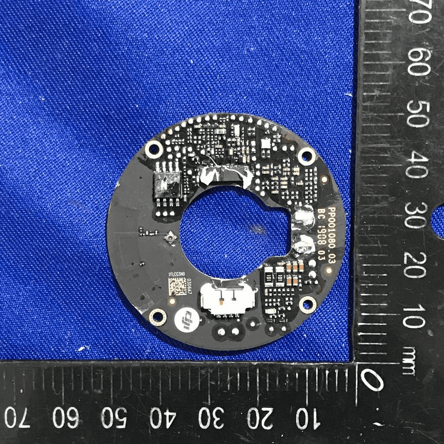 Circular PCB with sensor integration and power regulation.
