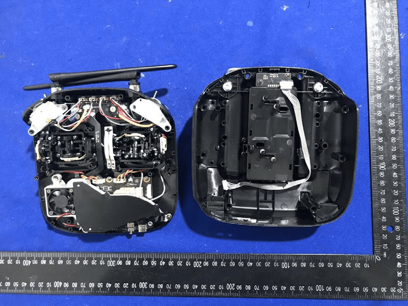 Main PCB with EMI shield, battery compartment, and modular connectors.