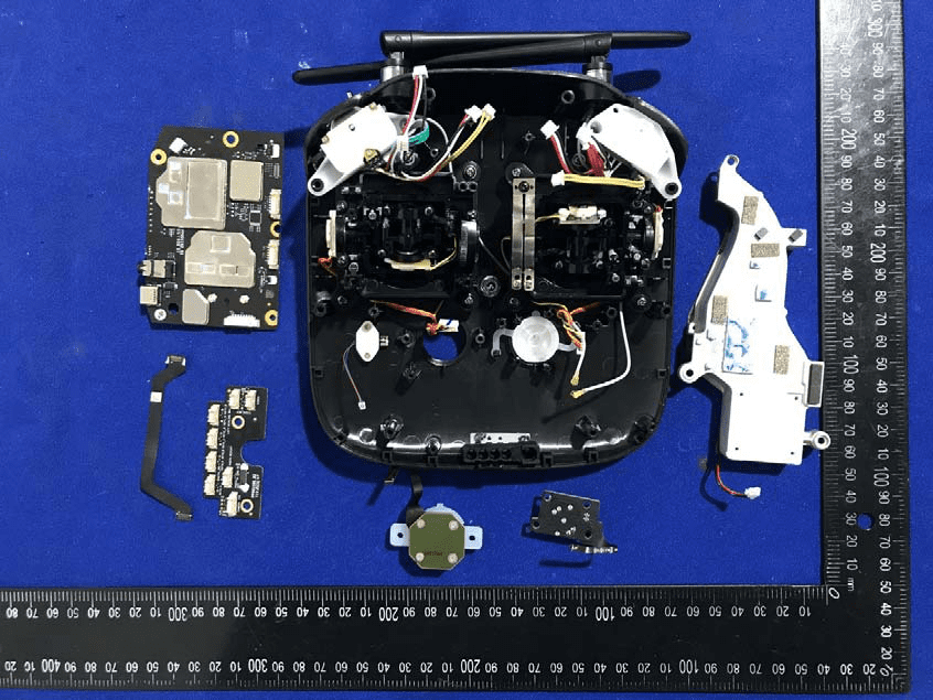 Disassembled layout showing main PCB, antennas, and gimbal assemblies.