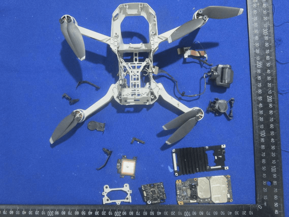 Shielded PCBs, GPS antenna, and camera/gimbal modules laid out.
