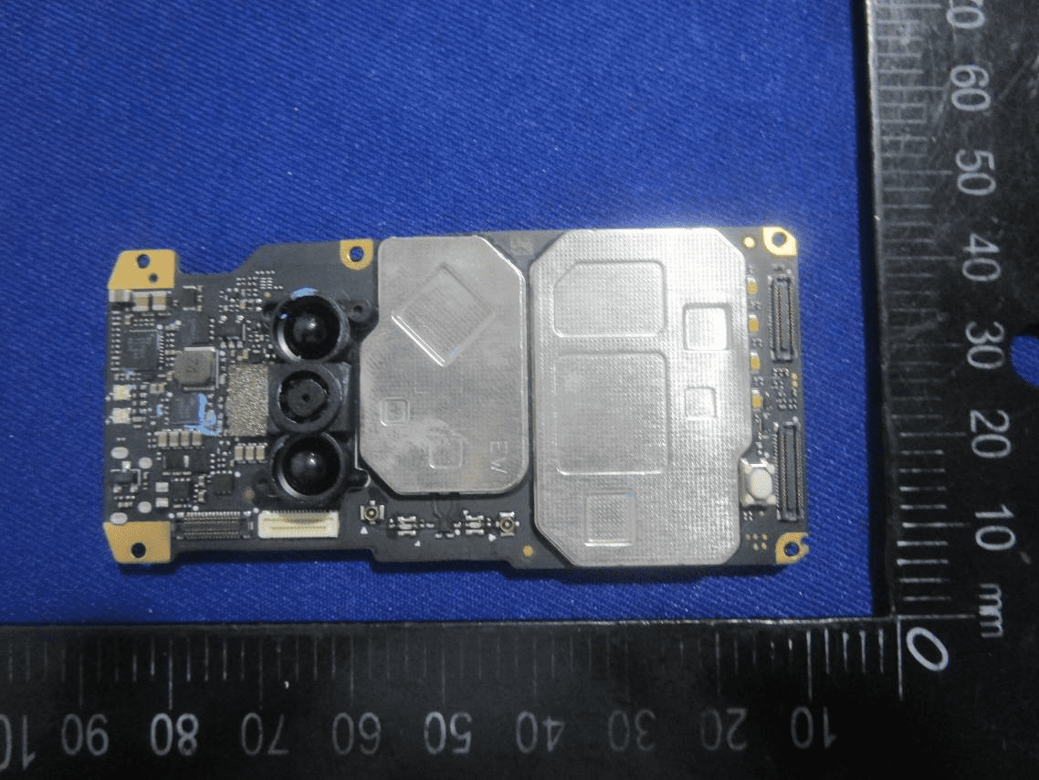 Densely packed PCB with EMI shields and vision system connectors.