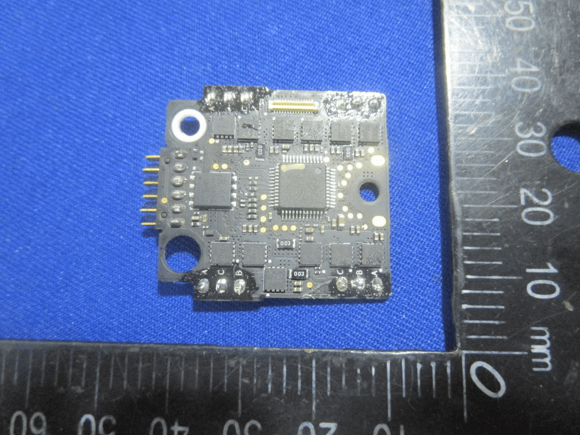Flight controller PCB with MCU and sensor integration.